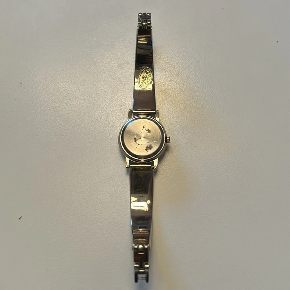 Two vintage quartz watches one stainless steel with hearts one with blue trim